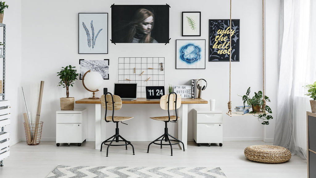 Photo of a sleek, modern home office that illustrates the concept of home offices affecting homeowners insurance coverage.