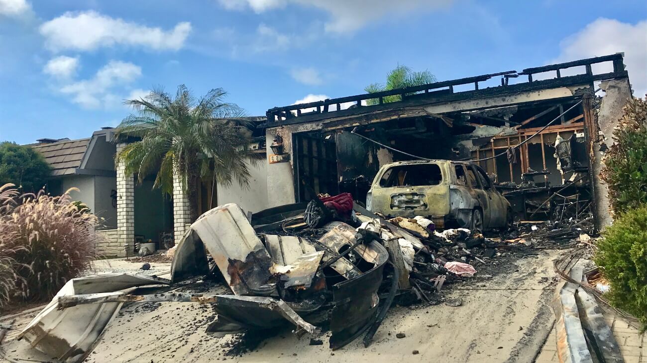 Fire damage to garage after a house fire