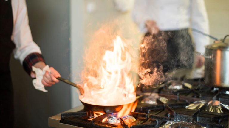 The contents of a frying pan on fire