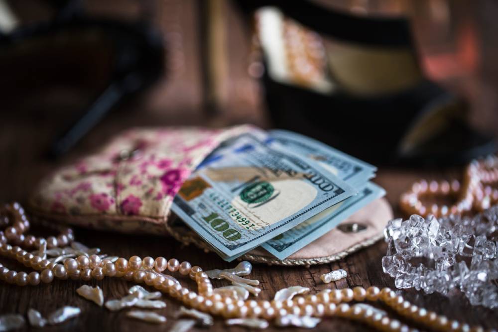 Money and jewelry on a table