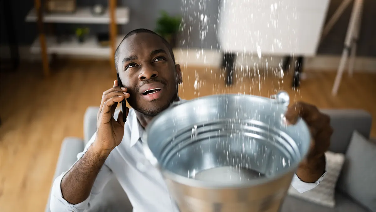 leaking water man calling insurance