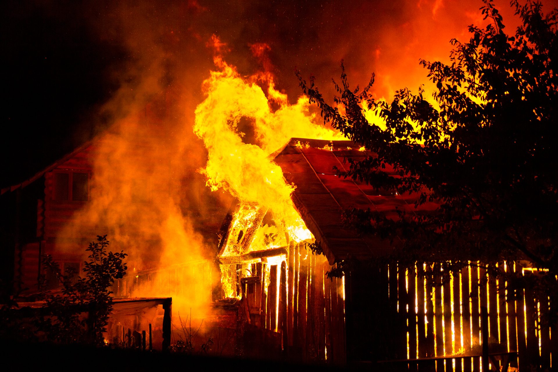 A house burning in the aftermath of a wildfire